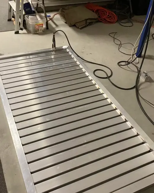 Custom aluminium slat panel fabricated in the workshop