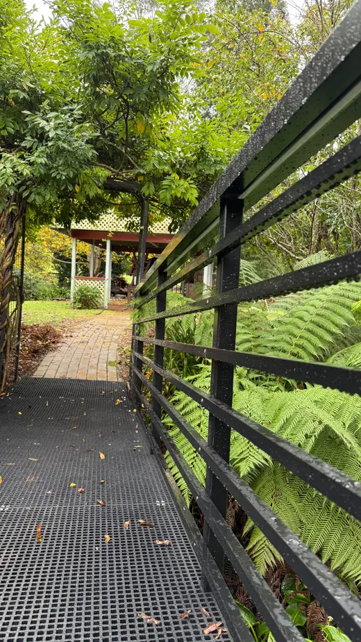 Steel balustrade with horizontal bars along a walkway